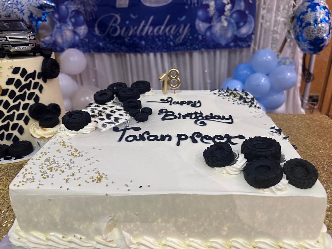 Novelty 18th birthday sheet cake with chocolate tyre decorations, by Cakes & Bakes Barkingside